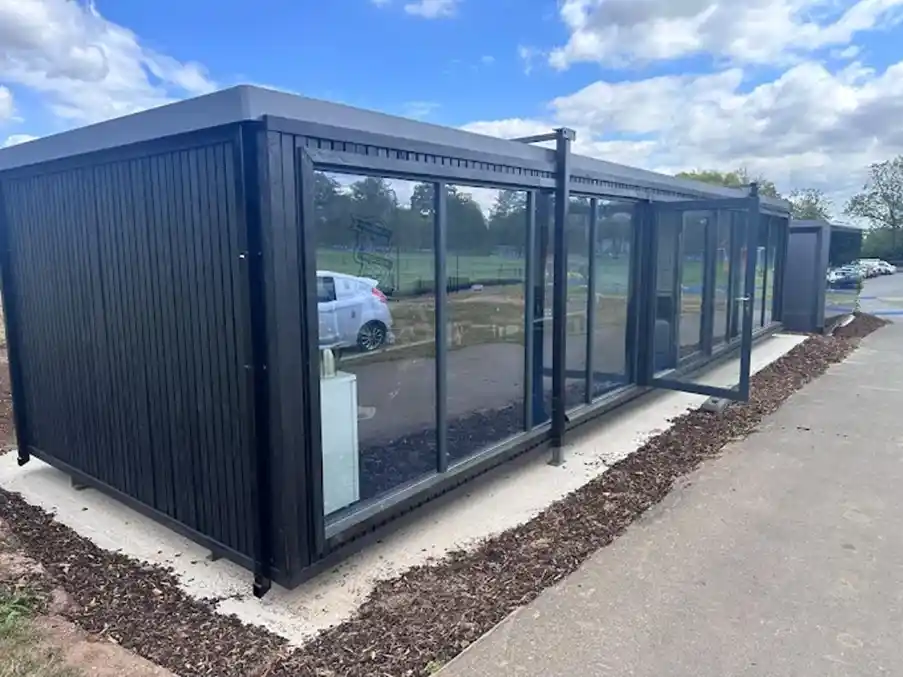 Modern modular building with high-performance glazing and landscaped grounds